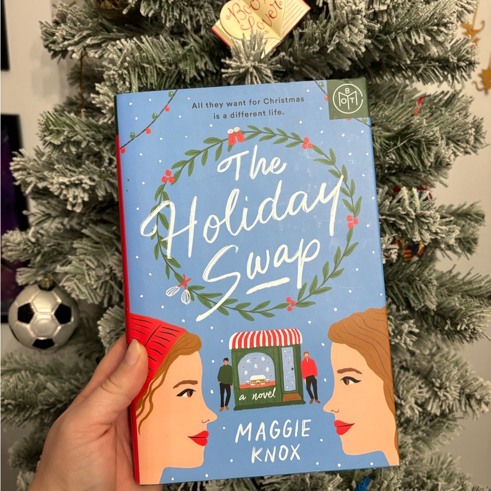 The Holiday Swap by - Festive Blue and Red Cover